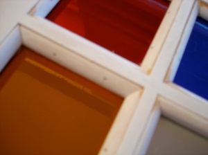 Panes pressed into glazing putty and secured with baton strips